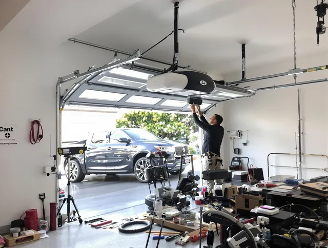 Farmington Garage Door Repair specialist installing smart garage door opener system in Farmington home